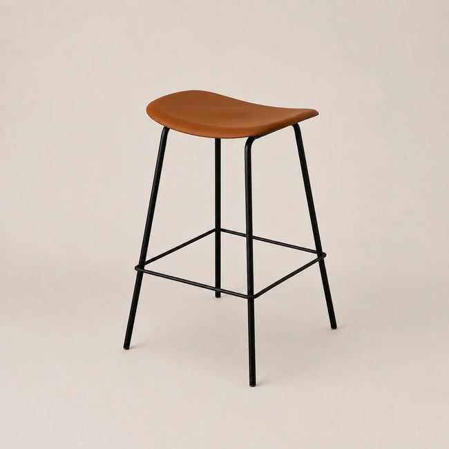 Bar stool with wooden seat and black metal legs on a beige background