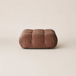 Brown cushion on a beige background