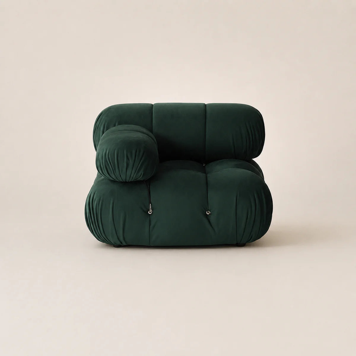 Dark green inflatable chair on a beige background