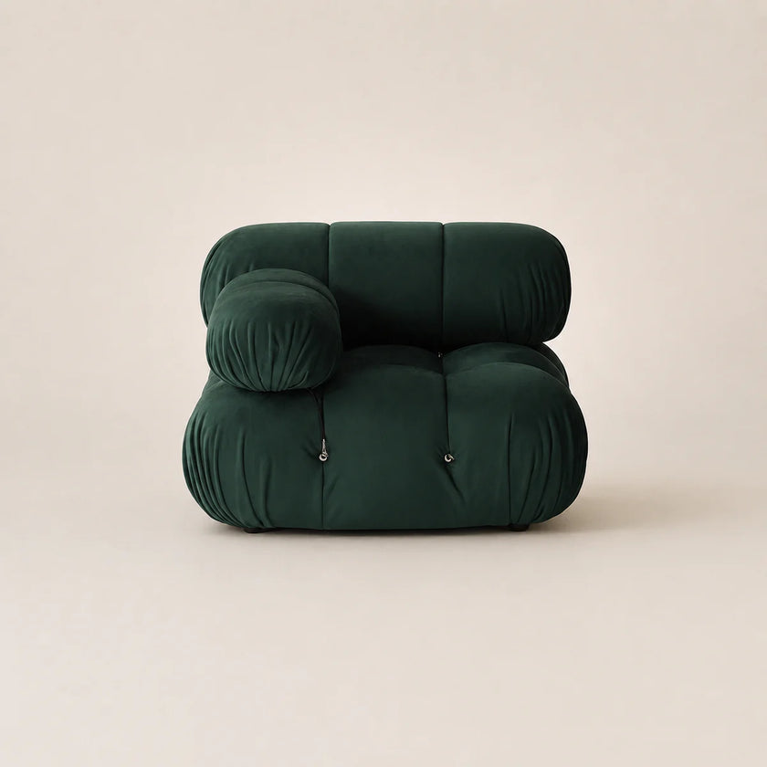 Dark green inflatable chair on a beige background