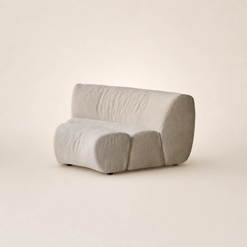 Modern gray sofa on a beige background