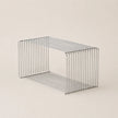 Wire basket on a beige background