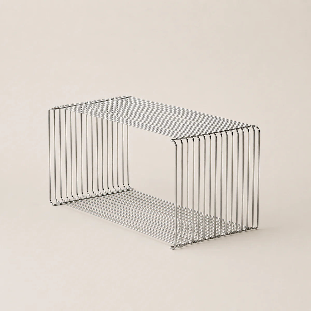Wire basket on a beige background