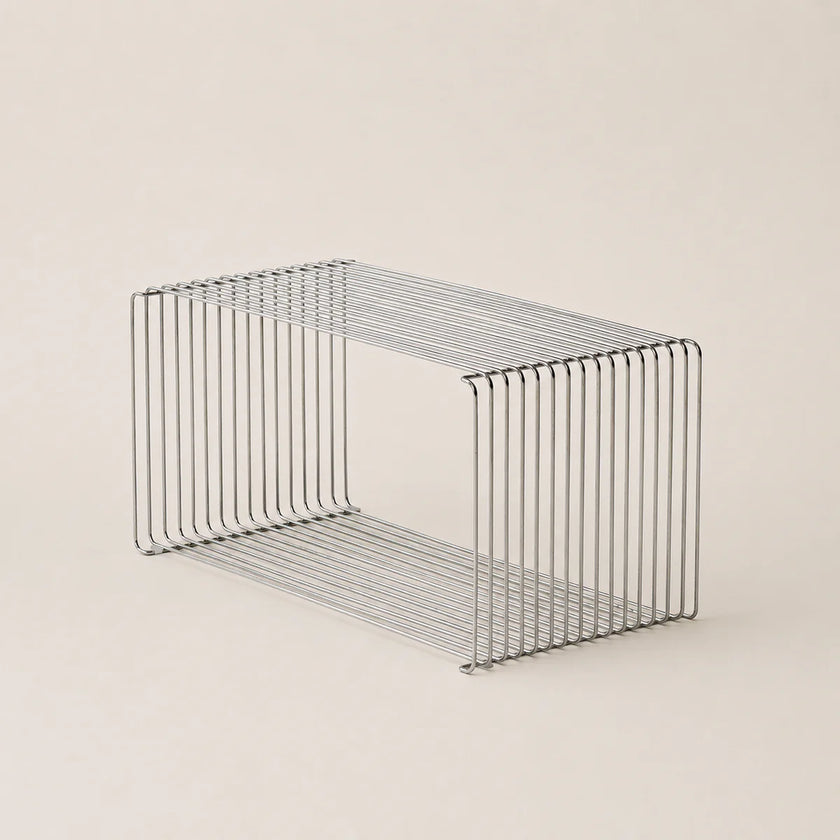 Wire basket on a beige background