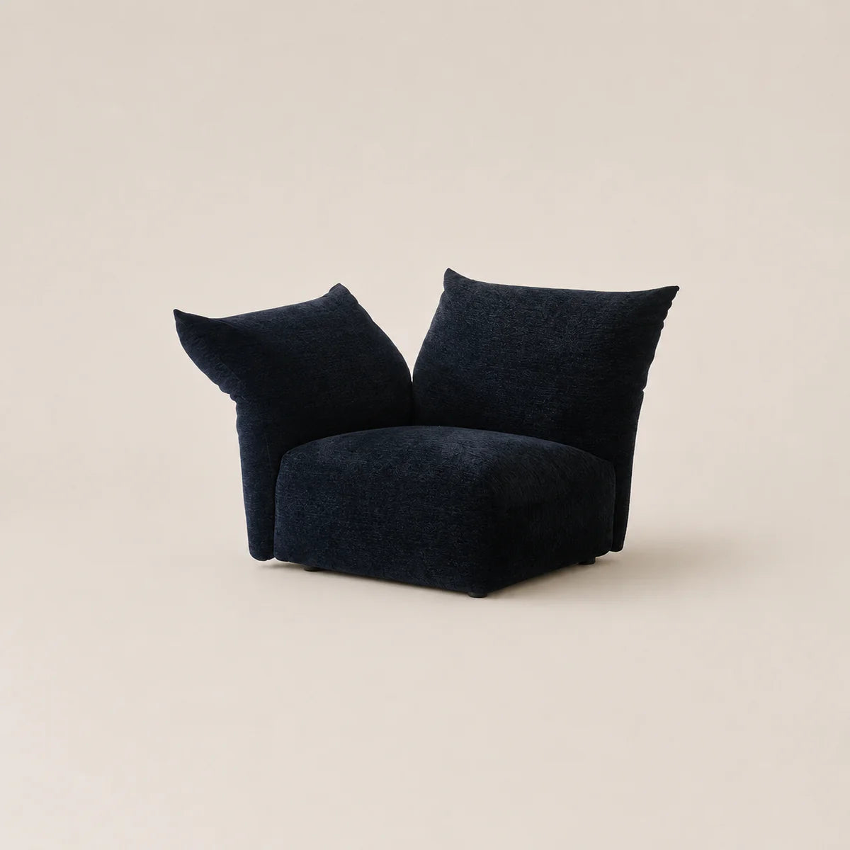 Black bean-shaped chair on a beige background