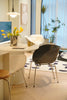 Modern dining area with a round table, dining chairs, and decorative elements.
