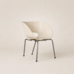 Modern chair with wavy design on a beige background