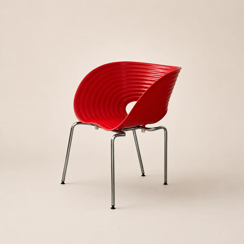 Red chair with ribbed design on a beige background