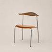 Chair with wooden seat and backrest on a beige background