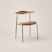 Chair with wooden backrest and seat on a beige background