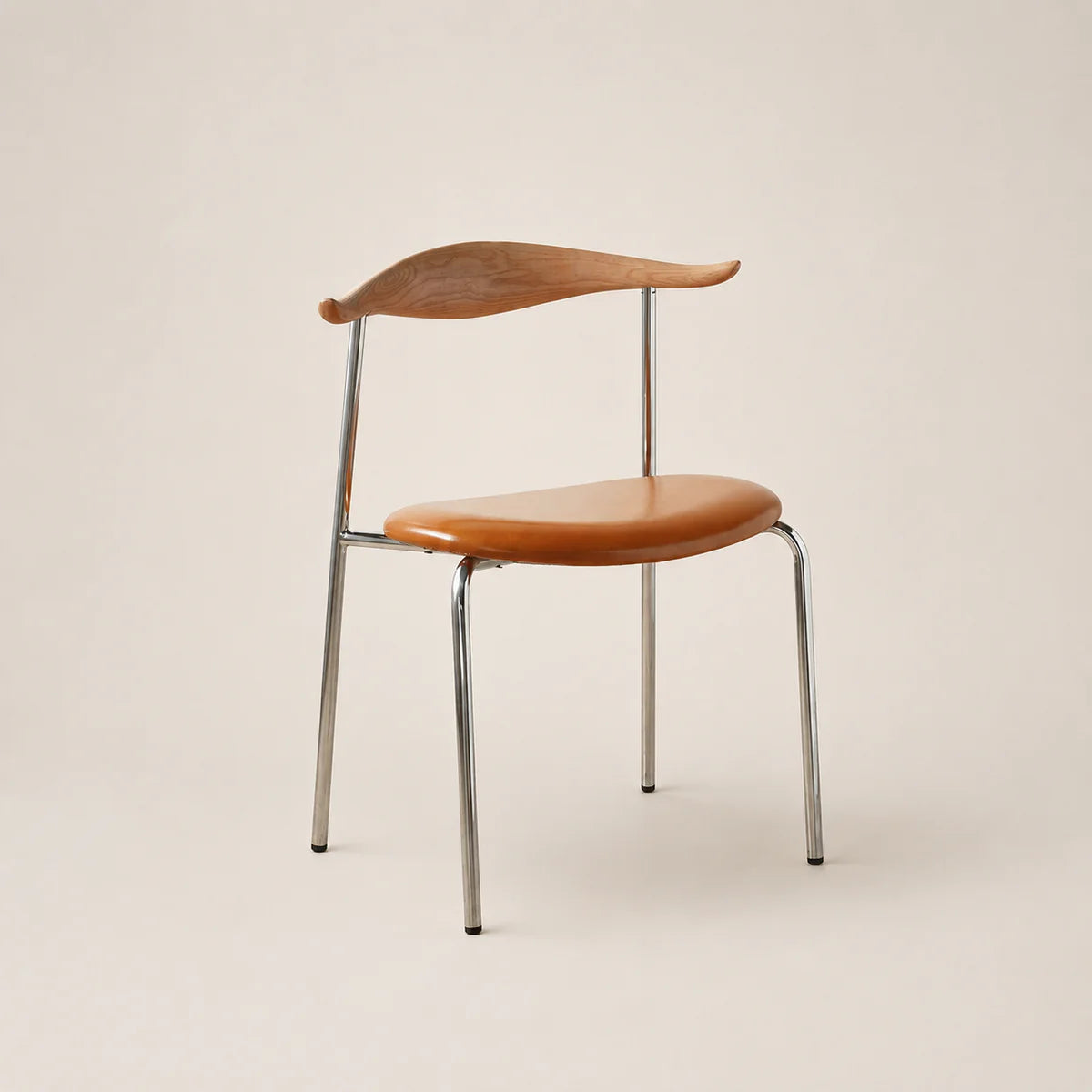 Chair with wooden seat and backrest on a beige background