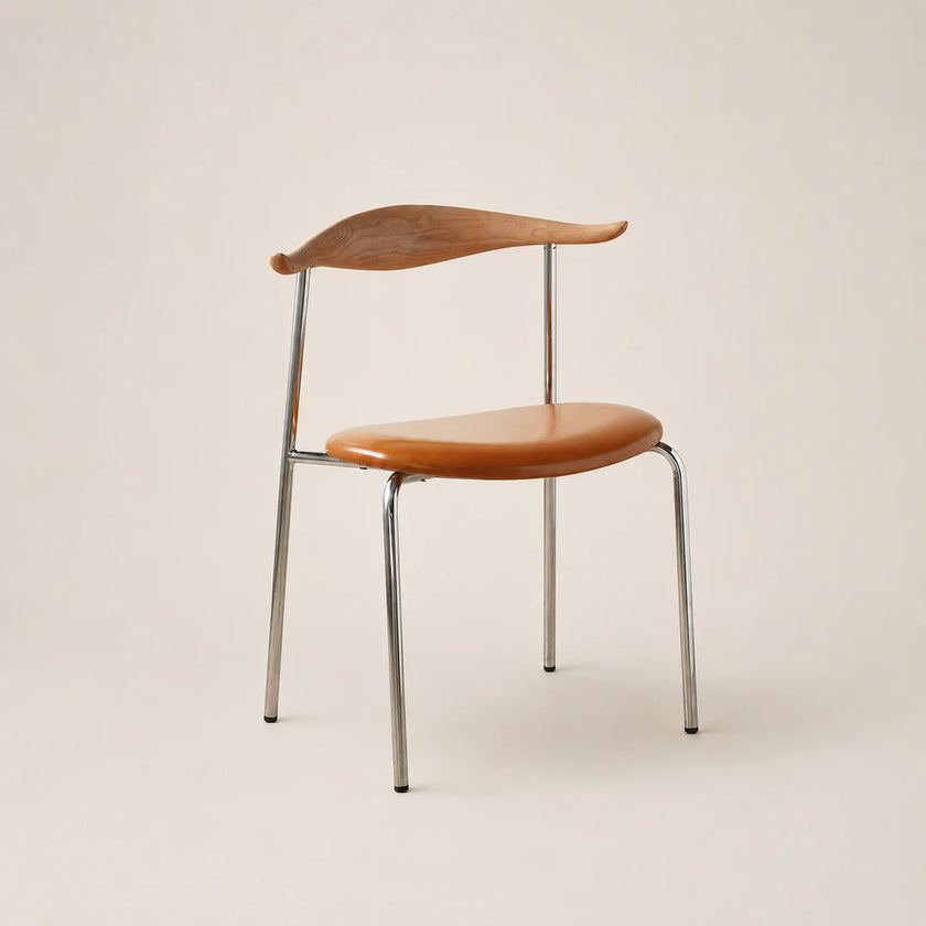 Chair with wooden seat and backrest on a beige background