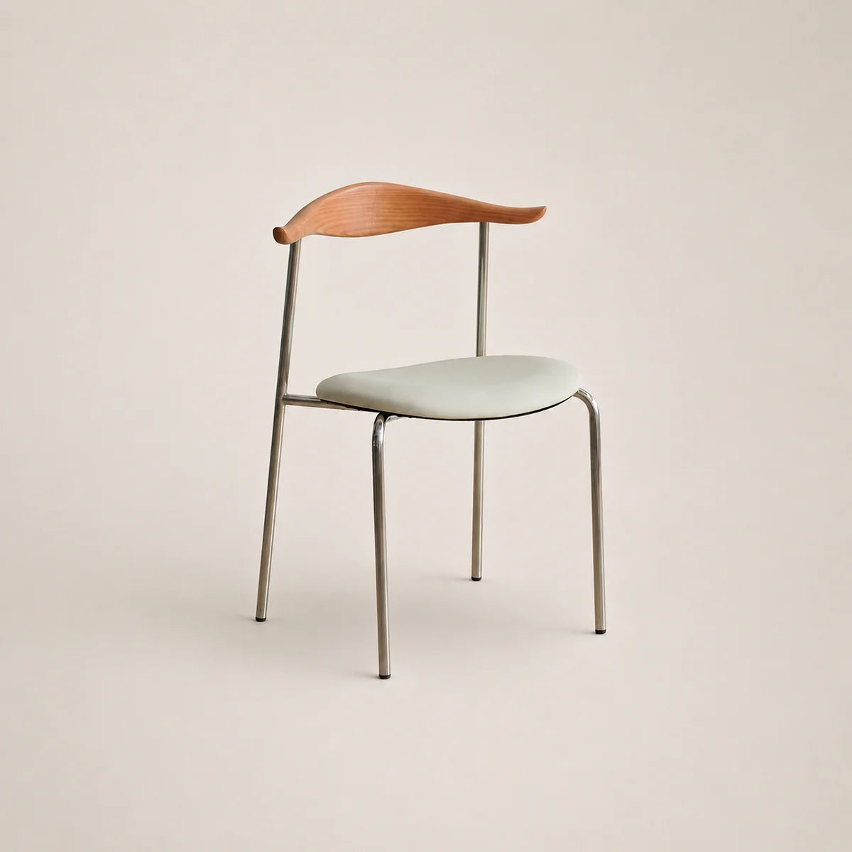 Modern chair with wooden backrest and light-colored seat on a beige background