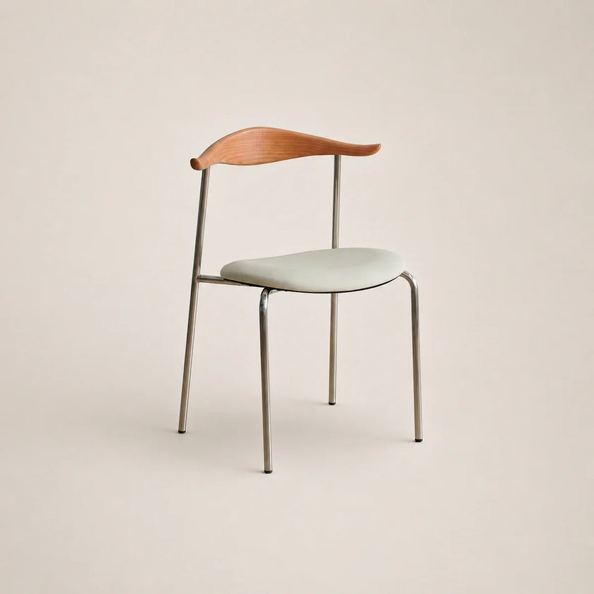 Modern chair with wooden backrest and light-colored seat on a beige background