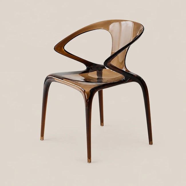 A modern translucent plastic dining chair with a curved backrest and four legs, shown on a solid light beige background.