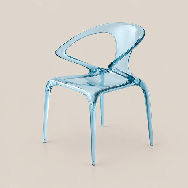 A translucent light blue molded chair with a curved back and four legs, shown on a plain warm beige studio background.