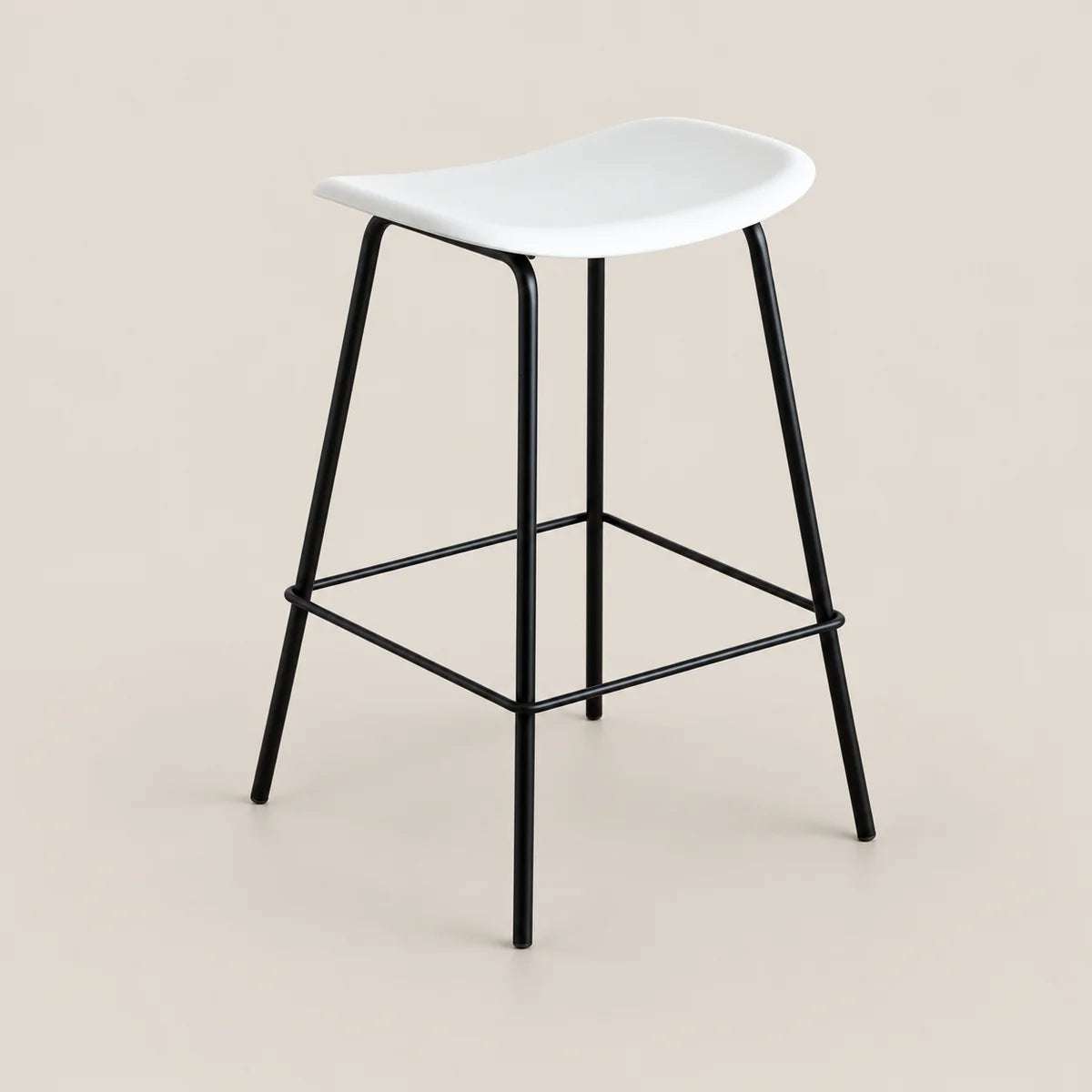 A modern counter stool with a white molded seat and a black metal frame with a footrest, set against a solid beige background.