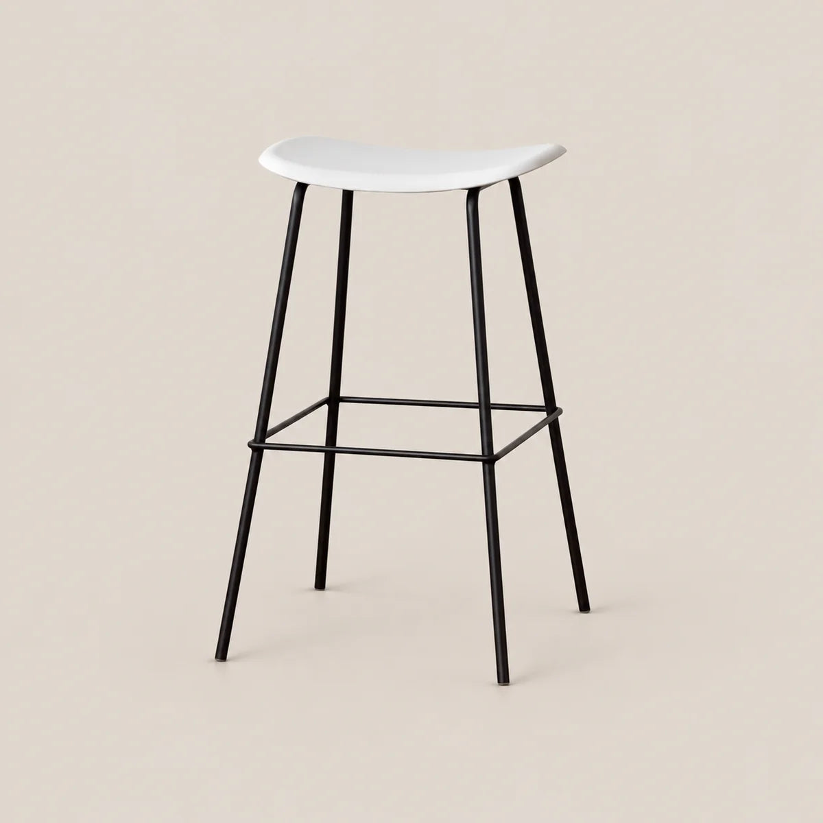 A modern bar stool with a white molded seat and black metal legs, shown against a solid light beige background.