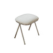 White cushioned stool with metal legs on a white background