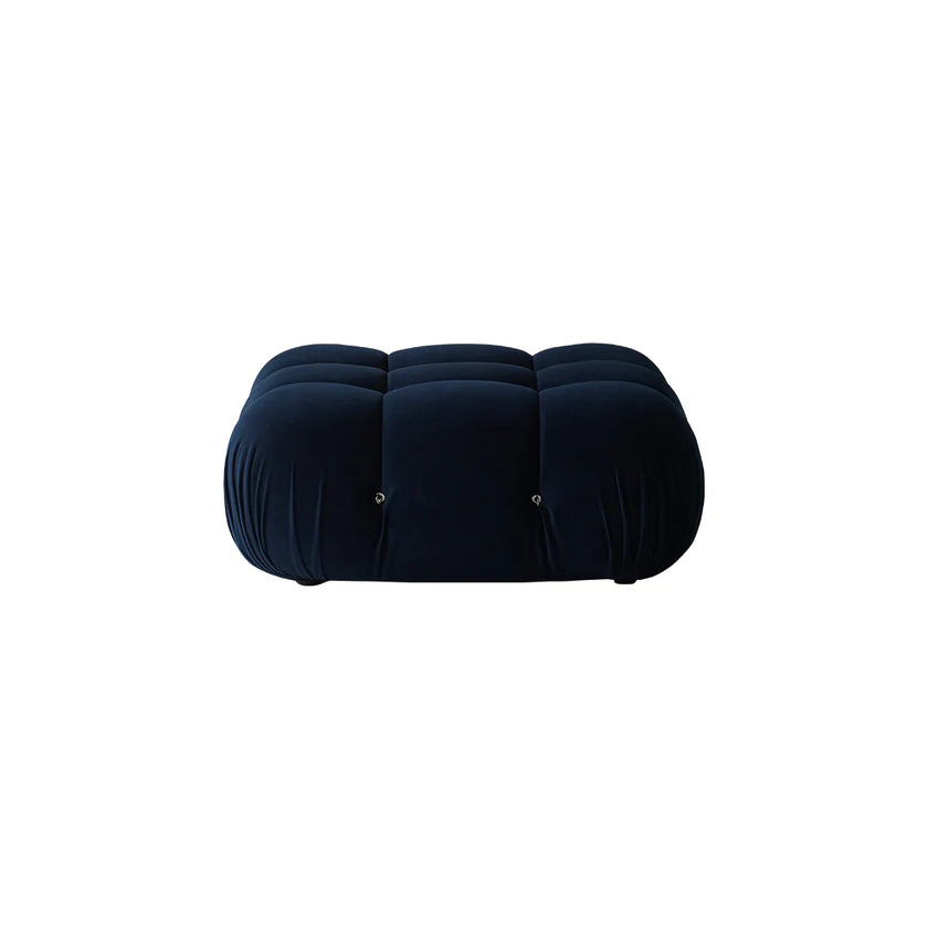 Black cushioned ottoman on a white background