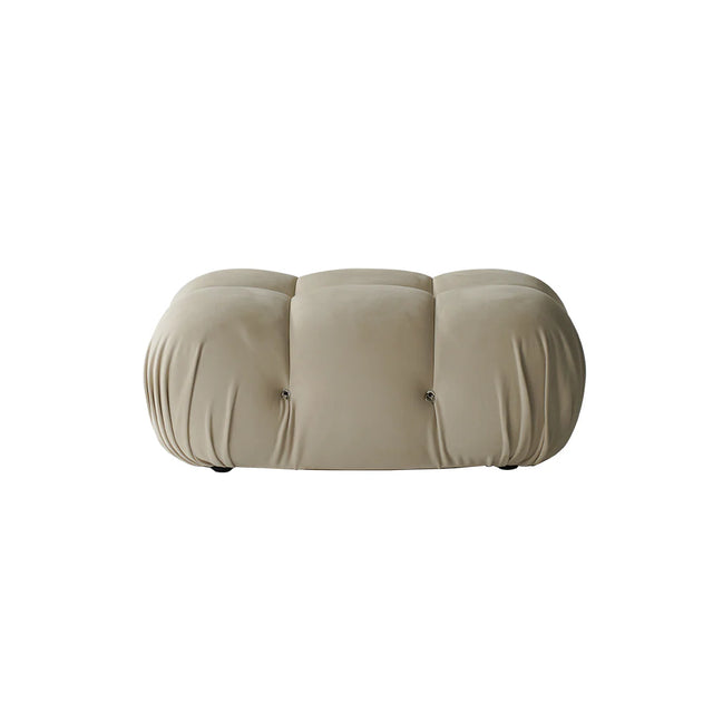 Beige cushioned ottoman on a white background