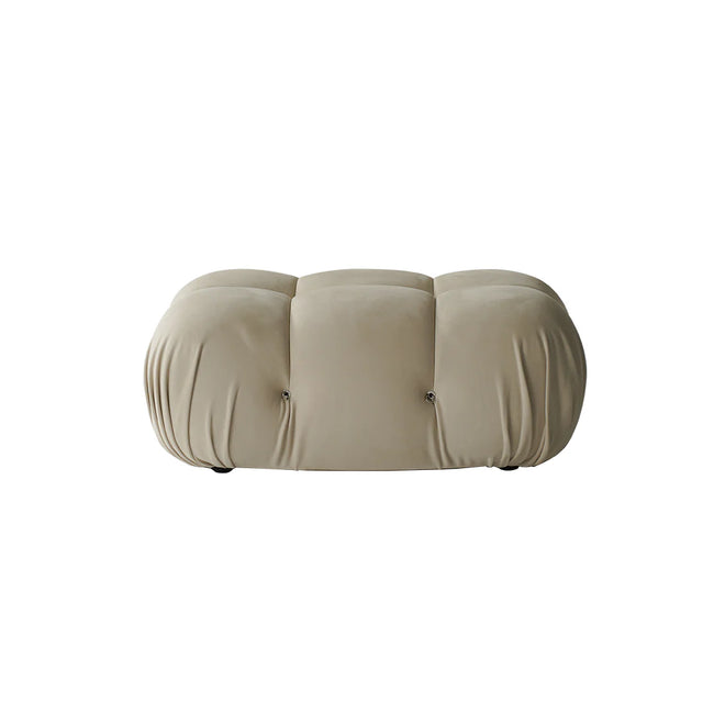 Beige cushioned ottoman on a white background