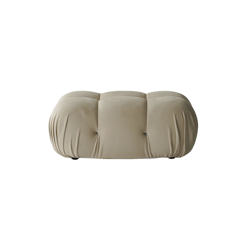 Beige cushioned ottoman on a white background