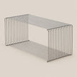 A rectangular metal wire storage basket with two tiers, shown on a solid light beige background.