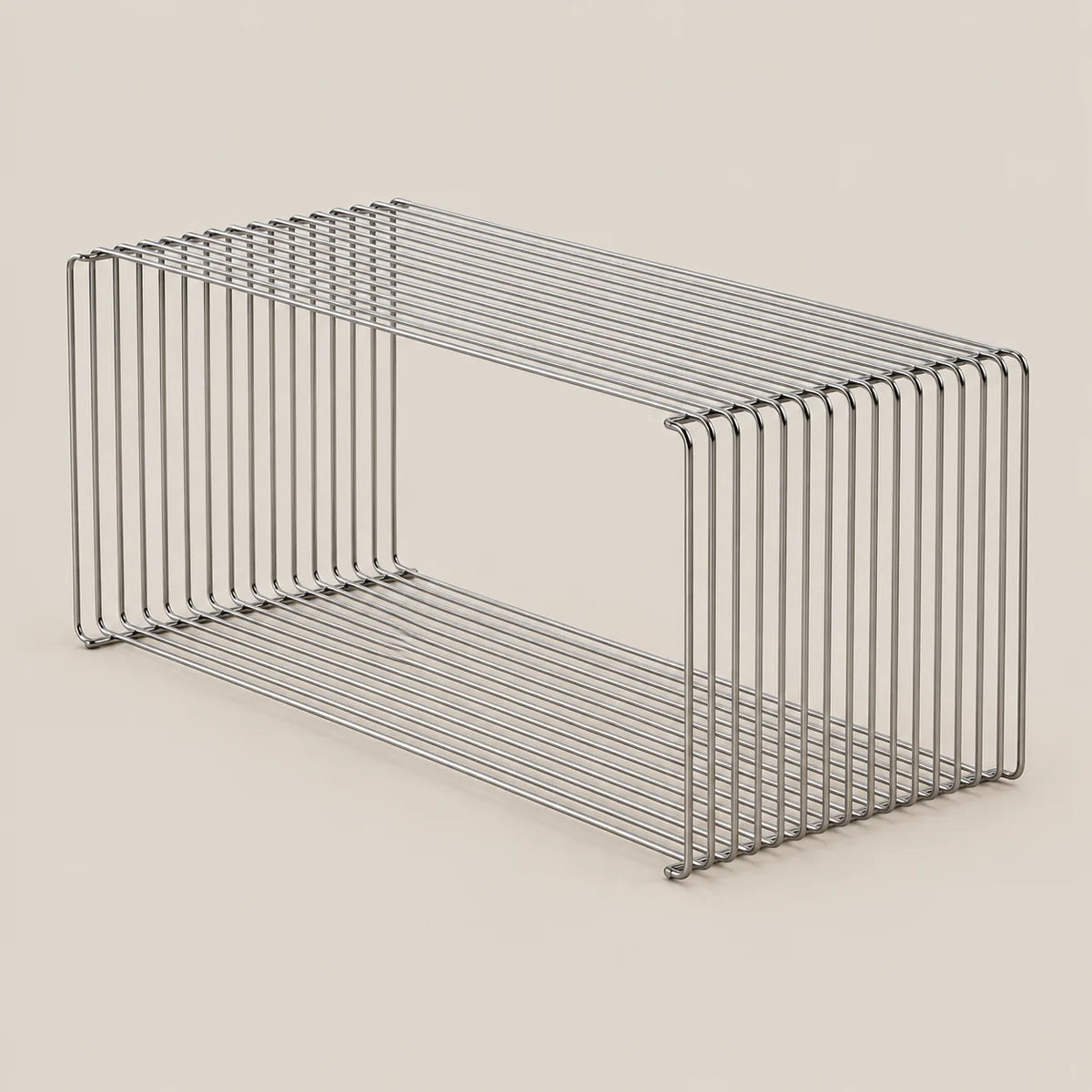 A rectangular metal wire storage basket with two tiers, shown on a solid light beige background.
