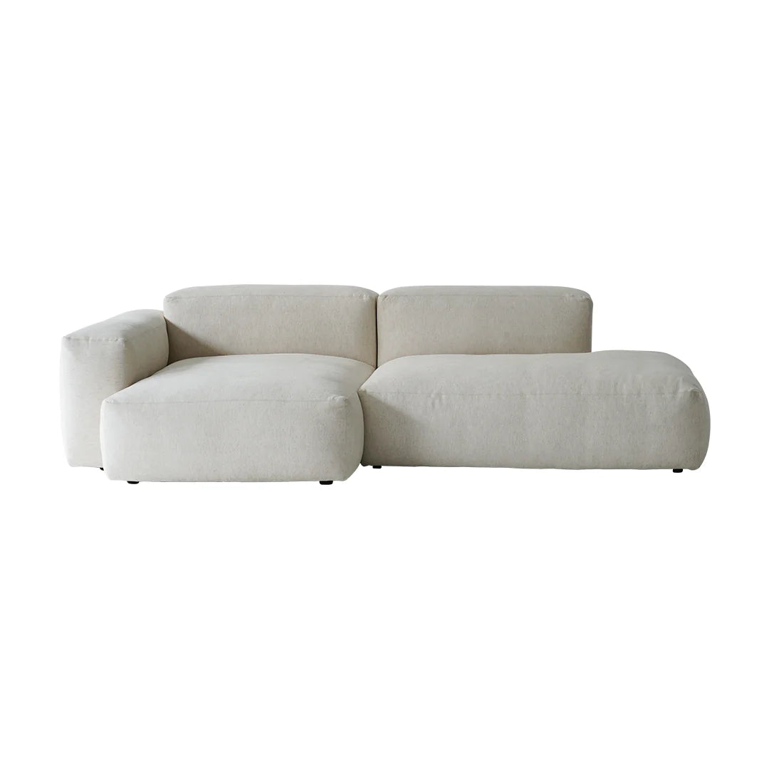 Beige sectional sofa on a white background