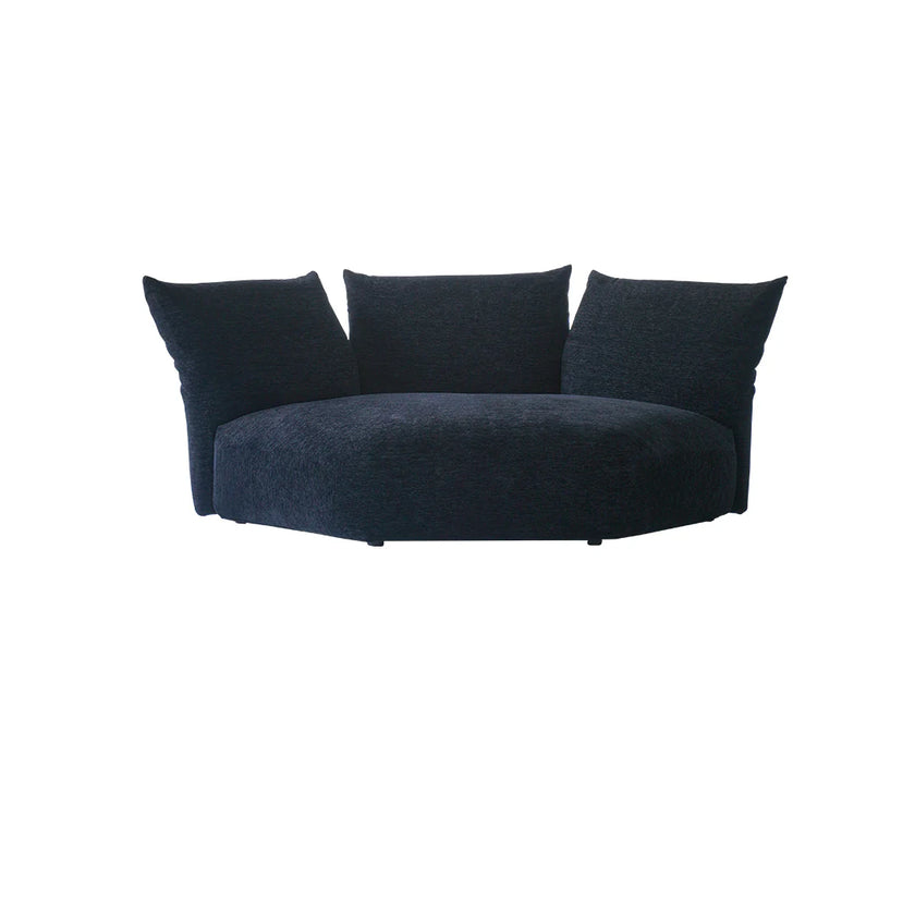 Modern navy blue sofa with three cushions on a white background