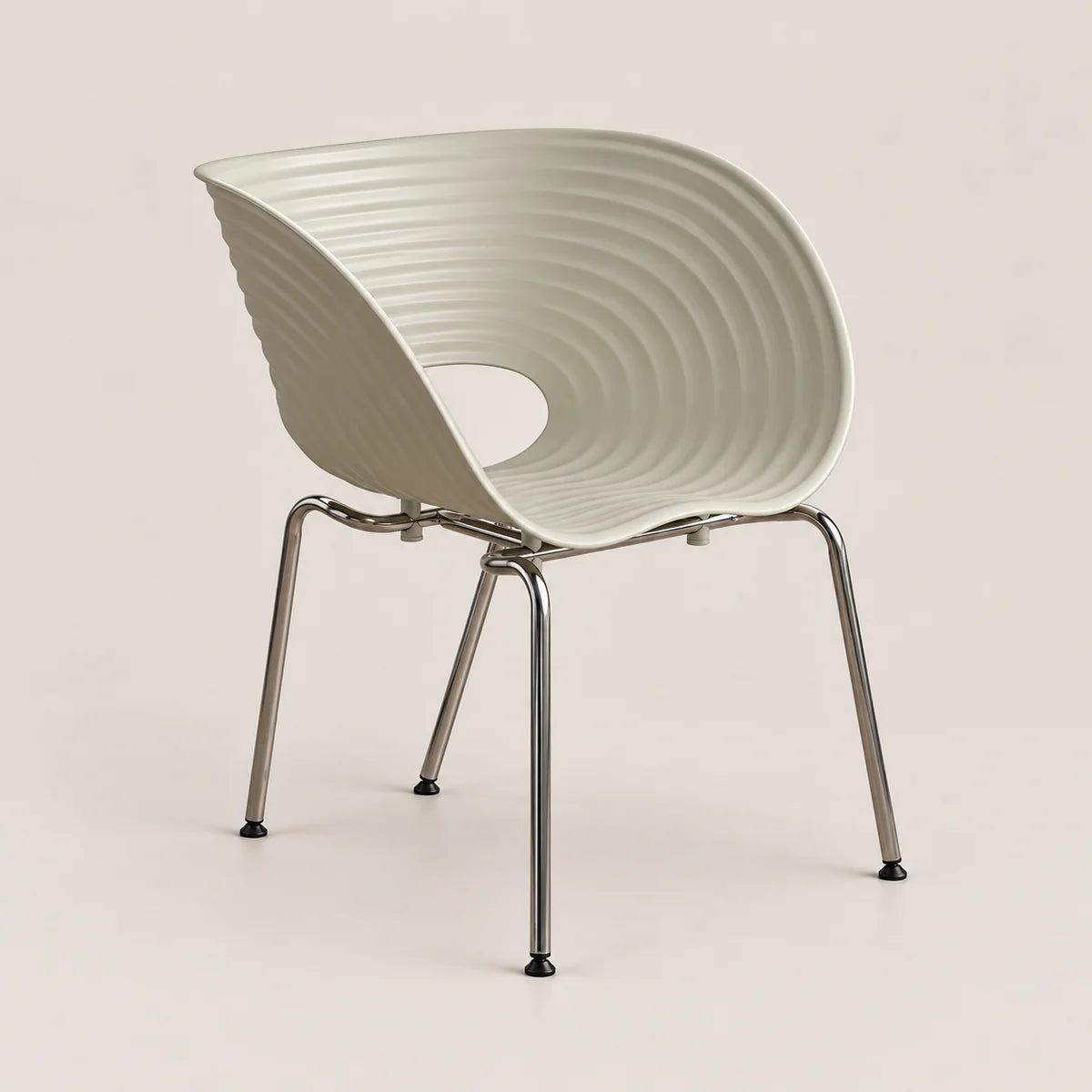 A modern molded plastic chair with a ribbed, curved shell and slim metallic legs, shown against a solid light beige background.