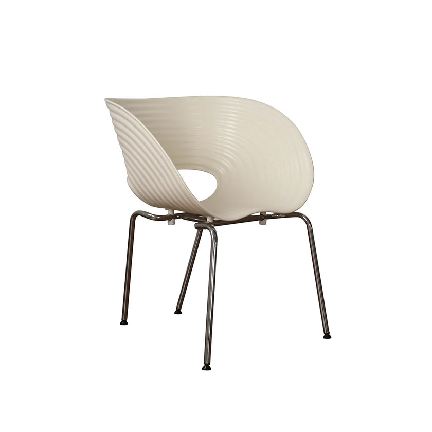 Modern chair with ribbed beige backrest and metal legs on a white background